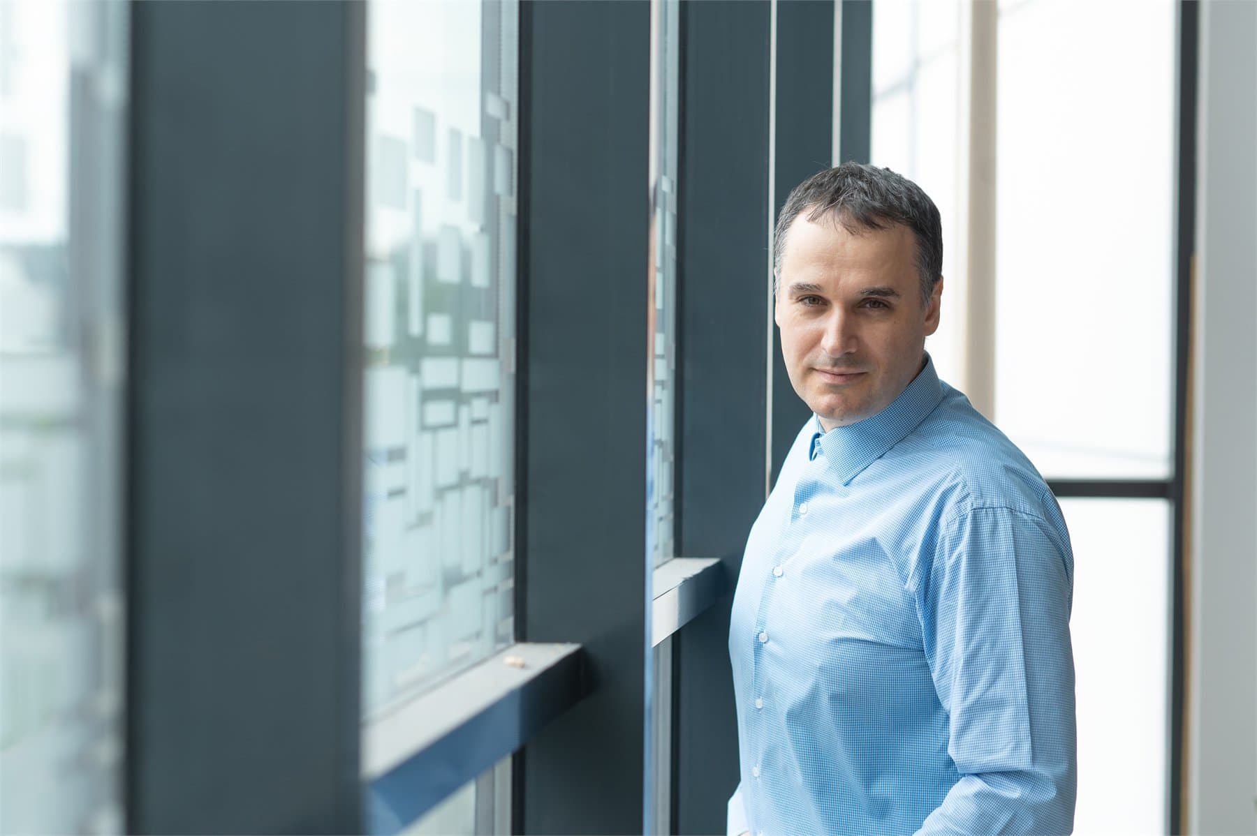 Ivan Yosifov in a modern office setting.